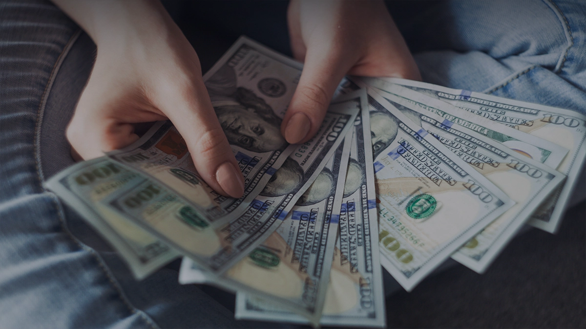 a wad of cash in someones hand - how profitable is a porta potty business - Learn how profitable the portable restroom industry can be for portable restroom operators from the pros at ServiceCore!