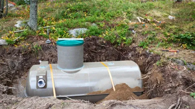 septic tank being dug out |  managing septic tank customers on the go | ServiceCore software for portable restroom & dumpster companies”