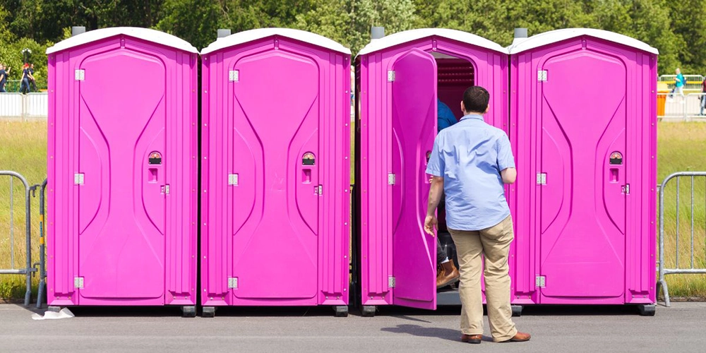 Hot pink porta potties - How Many Toilets Do You Need to Start Portable Restroom Business? - ServiceCore Blog