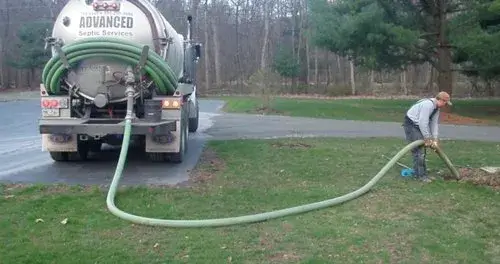 lady using septic hose | Equipment needed to run a septic tank company | ServiceCore software for portable restroom & dumpster companies”