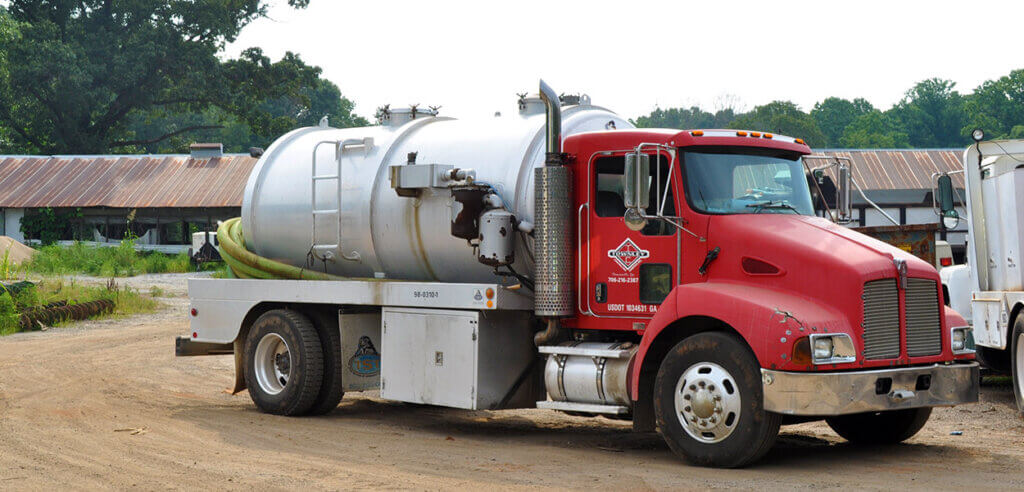 red septic truck | advantages of buying a septic system business | ServiceCore software for portable restroom & dumpster companies”