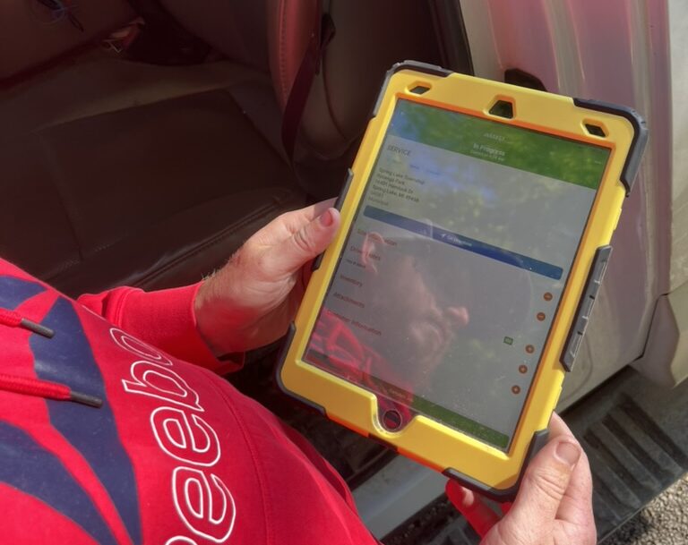 porta potty operator viewing the ServiceCore dashboard on their tablet device